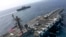 Архівне фото: Фото опубліковане ВМС США 17 травня 2019 року - авіаносець USS Abraham Lincoln (CVN 72) і десантний корабель типу Wasp USS Kearsarge (LHD 3). Авіаносна ударна група отримала наказ прискорити вихід на Близький Схід. 
