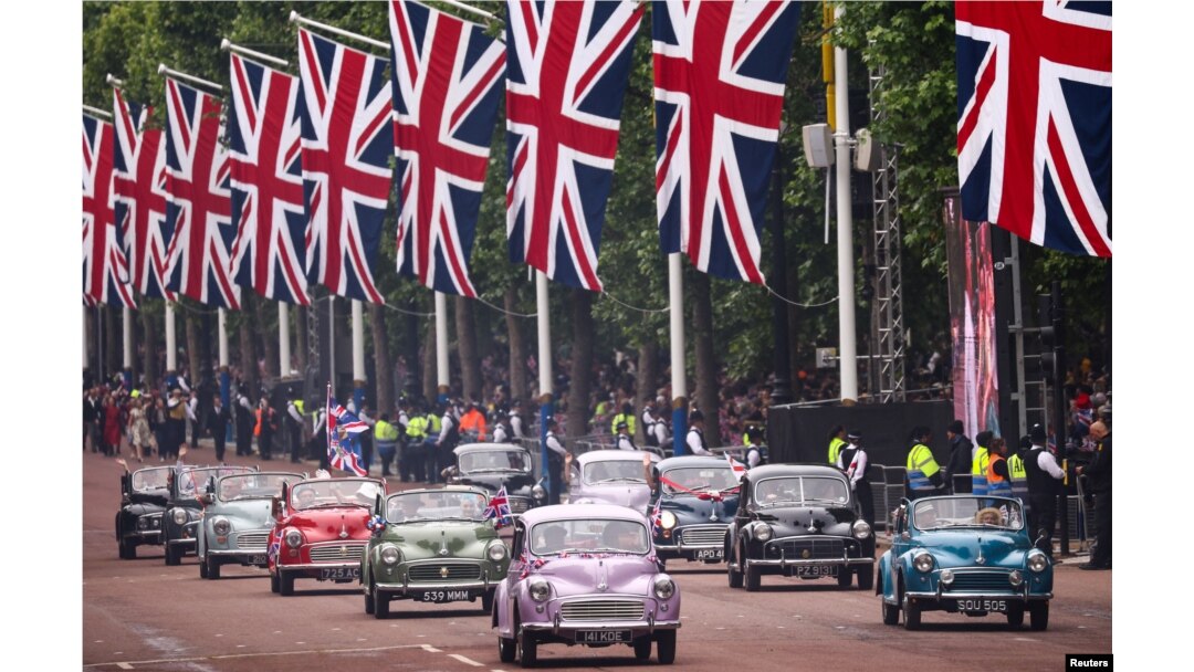 Morris Minor cars are seen during the Platinum Jubilee Pageant, marking the end of the celebrations for the Platinum Jubilee of Britain's Queen Elizabeth, in London, June 5, 2022.