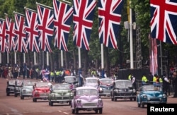 Morris Minor cars are seen during the Platinum Jubilee Pageant, marking the end of the celebrations for the Platinum Jubilee of Britain's Queen Elizabeth, in London, June 5, 2022.