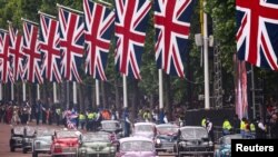 Morris Minor cars are seen during the Platinum Jubilee Pageant, marking the end of the celebrations for the Platinum Jubilee of Britain's Queen Elizabeth, in London, June 5, 2022.