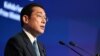  Japan’s Kishida Vows Expanded Security Role in Asia 