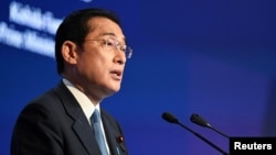 Japan's Prime Minister Fumio Kishida delivers the keynote address at the opening dinner of the 19th Shangri-La Dialogue in Singapore, June 10, 2022. 