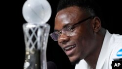 Oscar Tshiebwe of Kentucky decided not to go to the NBA even after winning the AP's Player of the Year award in Men's Basketball. (AP Photo/Gerald Herbert)