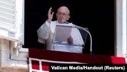 Pope Francis leads Angelus prayer from his window at the Vatican, June 12, 2022. 