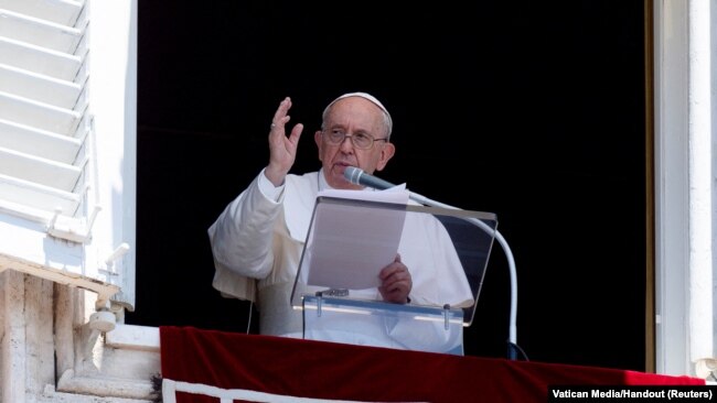 FILE - Pope Francis leads Angelus prayer from his window at the Vatican, June 12, 2022.