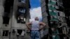 A man stands looking at a building destroyed during attacks, in Borodyanka, on the outskirts of Kyiv, Ukraine, June 4, 2022.
