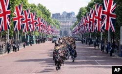 The Kings troop of the royal horse artillery ride down the Mall on their way to fire ceremonial gun in London, Thursday June 2, 2022. (Richard Pohle, Pool Photo via AP)