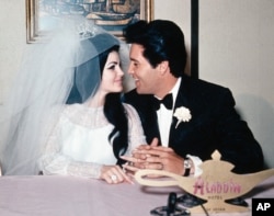 In this May 1, 1967, file photo, singer Elvis Presley and his bride, the former Priscilla Beaulieu, appear at the Aladdin Hotel in Las Vegas, after their wedding. (AP Photo/File)
