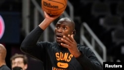 Phoenix Suns center Bismack Biyombo (18) warms up on the court prior to the game against the Atlanta Hawks at State Farm Arena in Atlanta, Georgia, Feb 3, 2022.