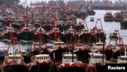 Hundreds of fishing vessels fill up Hong Kong's Aberdeen typhoon shelter on the first day of a two-month fishing ban in seas 12 degrees latitude north of the Beibu Gulf, also known as the Gulf of Tonkin, June 1, 2005.