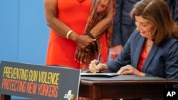 New York Gov. Kathy Hochul signs a package of bills to strengthen gun laws, June 6, 2022.