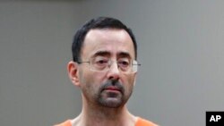 FILE - Dr. Larry Nassar, appears in court for a plea hearing on Nov. 22, 2017, in Lansing, Mich.