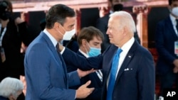 FILE - U.S. President Joe Biden, right, and Spain's Prime Minister Pedro Sanchez talk during the opening session of the G-20 summit at the La Nuvola conference center, in Rome, Oct. 30, 2021.