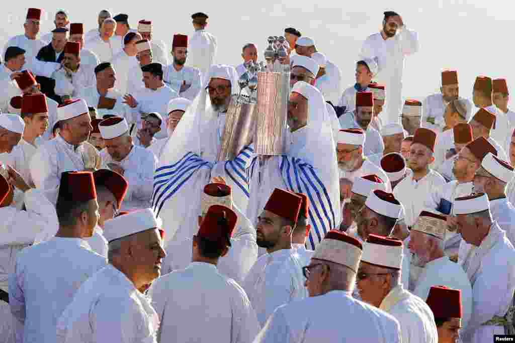 Members of the Samaritan sect take part in a traditional pilgrimage marking the holiday of Shavuot, atop Mount Gerizim, in Nablus in the Israeli-occupied West Bank.