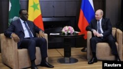 Russia's President Vladimir Putin (right) attends a meeting with Senegal's President Macky Sall, who is currently the chairman of the African Union, at the Bocharov Ruchei state residence in Sochi, Russia, June 3, 2022, in a Sputnik/Mikhail Klimentyev/Kre