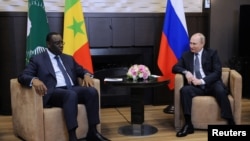 Russia's President Vladimir Putin (right) attends a meeting with Senegal's President Macky Sall, who is currently the chairman of the African Union, at the Bocharov Ruchei state residence in Sochi, Russia, June 3, 2022, in a Sputnik/Mikhail Klimentyev/Kremlin photo via Reuters. 