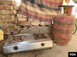 The cooking gas stoves that were meant to help poor households switch to a clean energy source for cooking lie unused in many homes in Saramthala. (Anjana Pasricha/VOA)