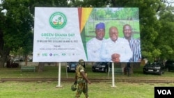 A sign publicizes an annual campaign to plant 20 million trees in Ghana, June 10, 2022. (Kent Mensah/VOA)