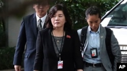 FILE - North Korean Vice Foreign Minister Choe Son Hui, center, arrives for a meeting with US Ambassador to the Philippines Sung Kim at the Ritz-Carlton Millenia Hotel in Singapore, June 11, 2018, ahead of the summit between U.S. President Donald Trump an