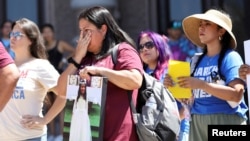 Gloria Cazares, mother of Jackie Cazares, who was killed in Robb Elementary School shooting in Uvalde, Texas, listens to speakers during a 'March for Our Lives' rally in Austin, Texas, June 11, 2022.