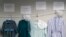 FILE - Dresses donated by sexual assault survivors from Amish and other plain-dressing religious groups hang on a clothesline beneath a description of each survivors' age and church affiliation,in Leola, Pennsylvania, April 29, 2022.