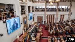 FILE: Ethiopian Primer Minister Abiy Ahmed (L) addresses the members of the Parliament during a session, in the city of Addis Ababa, Ethiopia, on June 14, 2022. 