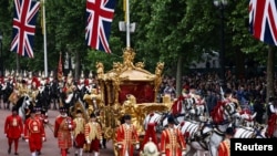 FILE - The Gold State Coach is seen during the Platinum Jubilee Pageant, marking the end of the celebrations for the Platinum Jubilee of Britain's Queen Elizabeth, in London, June 5, 2022.