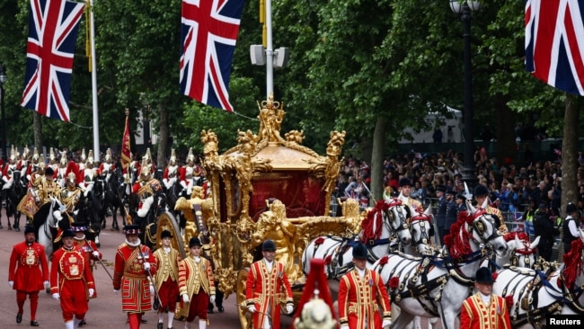 FILE - The Gold State Coach is seen during the Platinum Jubilee Pageant, marking the end of the celebrations for the Platinum Jubilee of Britain's Queen Elizabeth, in London, June 5, 2022.