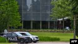 Police guard the entrance of the Natalie Medical Building at Saint Francis Hospital campus in Tulsa, Oklahoma, on June 2, 2022, a day after a gunman killed four people there.