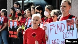 Sian Phillips and Gareth Phillips, siblings of missing journalist Dom Phillips, join demonstrators outside the Brazilian Embassy in London following the disappearance in the Amazon of their brother and campaigner Bruno Araujo Pereira, June 9, 2022.