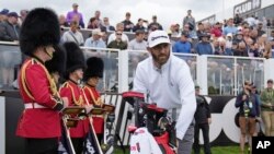 Dustin Johnson of the United States prepares to play from the first tee during the first round of the inaugural LIV Golf Invitational at the Centurion Club in St. Albans, England, June 9, 2022.