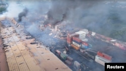 Drone footage shows smoke rising from the spot after a massive fire broke out in an inland container depot at Sitakunda, near the port city Chittagong, Bangladesh, June 5, 2022 in this still image obtained from a handout video. (Al Mahmud BS/Handout via R