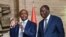 Le président ivoirien Alassane Ouattara, à gauche, et Patrice Motsepe, président de la CAF, après une réunion sur l'organisation de la CAN 2023 en Côte d'Ivoire, Abidjan, le 4 avril 2022.