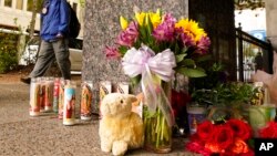 A memorial is seen near the location of a mass shooting in Sacramento, Calif., April 4, 2022.