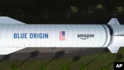 Overhead of the New Glenn rocket from Blue Origin, one of the three heavy-lift launch providers Amazon selected for Project Kuiper (featuring a mock-up of the Amazon logo). (Photo: Business Wire)