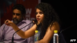 FILE - Indian journalist and author Rana Ayyub speaks during the launch of her self-published book 'Gujarat Files' in New Delhi, May 27, 2016.