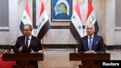 Wezîrê derve yê Sûriyê Feysel Miqdad û hevtayê wî yê Îraqê Fuad Husên 
