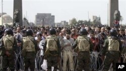 Egyptian protesters perform Friday prayers during a protest in Tahrir or Liberation Square in Cairo, Egypt, Feb 4, 2011