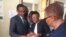 Umgcinisihlalo weMDC uNkosazana Thabitha Khumalo (ophakathi laphakathi) labanye bakhe ngemva kokulahlwa kwecala labo yinkantolo. 