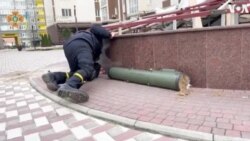 Ukrainian Rescuers Collect Ordnance They Say Was Left in Bucha 