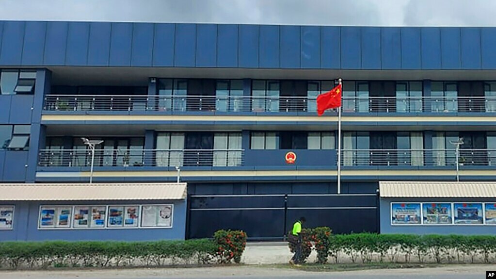 FILE - The Chinese national flag flies outside the Chinese Embassy in Honiara, Solomon Islands, April 1, 2022. (AP Photo/Charley Piringi)