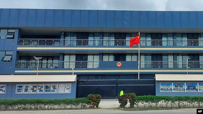 FILE - The Chinese national flag flies outside the Chinese Embassy in Honiara, Solomon Islands, April 1, 2022. (AP Photo/Charley Piringi)