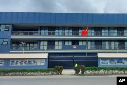 FILE - The Chinese national flag flies outside the Chinese Embassy in Honiara, Solomon Islands, April 1, 2022.