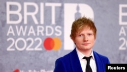 FILE - Ed Sheeran poses as he arrives for the Brit Awards at the O2 Arena in London, Britain, Feb. 8, 2022.