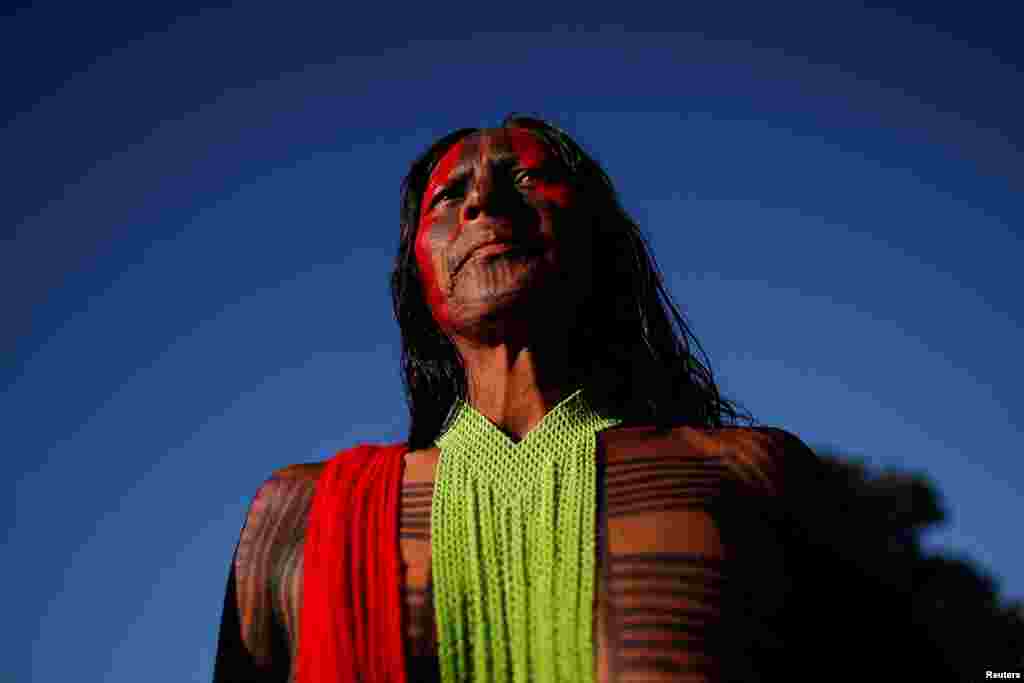 An indigenous person from the Kayapo tribe looks on during the Terra Livre (Free Land) protest-camp to defend indigenous land and cultural rights they say are threatened by the right-wing government of Brazil&#39;s President Jair Bolsonaro, in&nbsp;Brasilia, April 4, 2022.