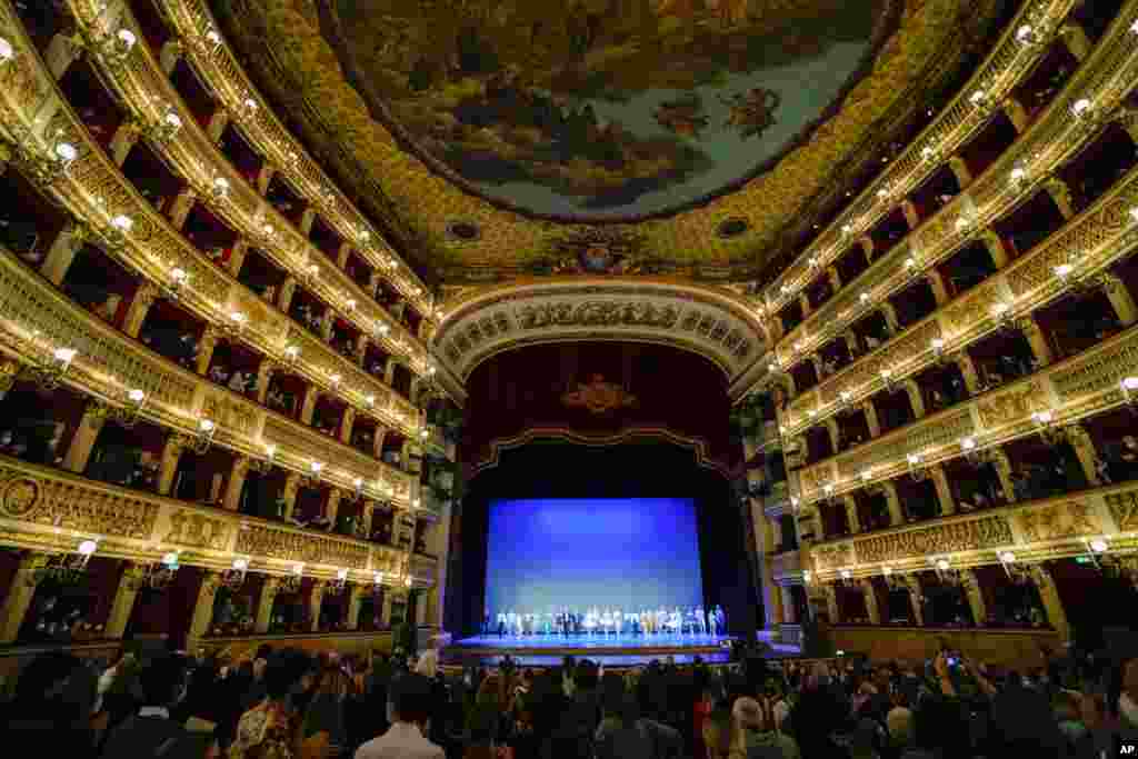 Ballet dancers recognize the cheers at the end of their performance at the Naples&#39; San Carlo opera house, Italy, April 4, 2022. Ukrainian and Russian dancers took part in a special show to raise money for the Red Cross and support the cause of peace in Ukraine.