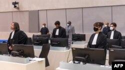 FILE - This handout photo obtained from the International Criminal Court via ANP on April 4, 2022, at the Hague shows former senior commander of the Sudanese Janjaweed militia Ali Muhammad Ali Abd-Al-Rahman, also known as Ali Kushayb. 