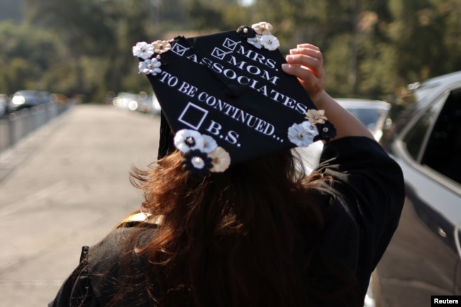 FILE - Student Marie Nangaray Saucedo, 52, takes part in a drive-through graduation at Rio Hondo Community College in Whittier, near Los Angeles, California, May 28, 2021. (REUTERS/Lucy Nicholson)