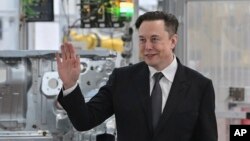 Tesla CEO Elon Musk attends the opening of the Tesla factory Berlin Brandenburg in Gruenheide, Germany, March 22, 2022. Elon Musk is taking a 9.2% stake in Twitter.