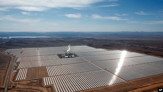 FILE - An aerial view of a solar power plant in Ouarzazate, central Morocco on Feb.4, 2016. Renewable energy's potential across the African continent remains largely untapped, according to a new report in April 2022 by the United Nation's Intergovernmental Panel on Climate Change. (AP Photo/Abdeljalil Bounhar, File)